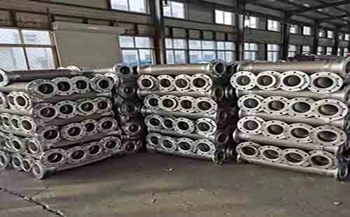 stacks of stainless steel flexible hose in a factory
