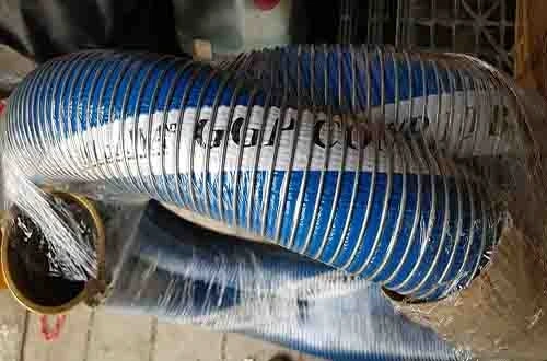 blue industrial hose wrapped in plastic with visible black text