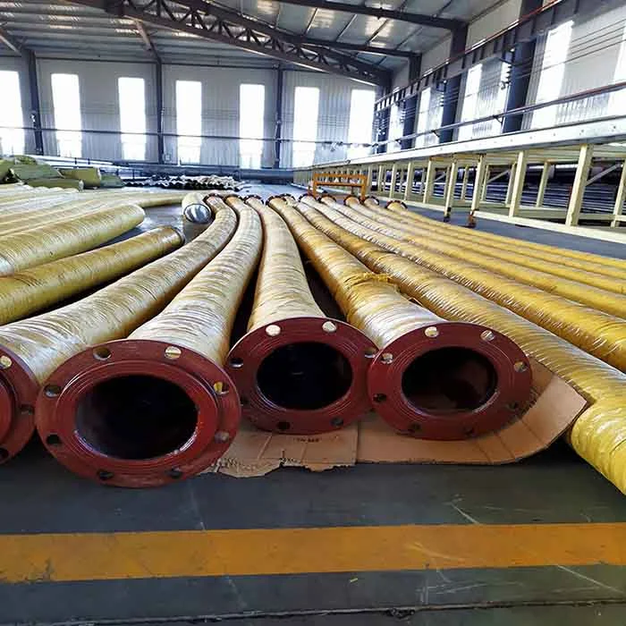 Several suction and discharge hoses were arranged on the factory floor.